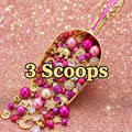 3 Scoops with charm-filled scoop, balls and glitter background